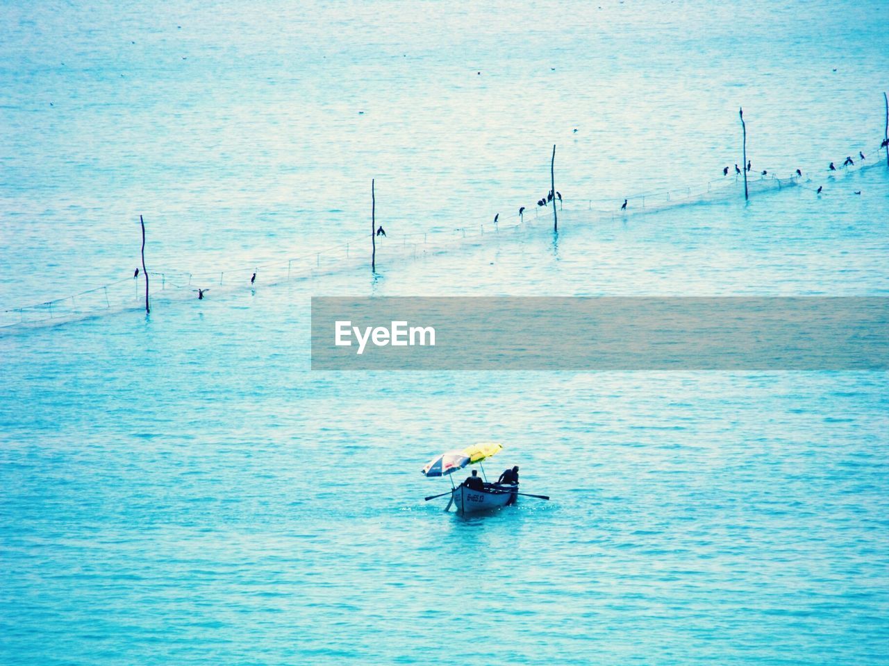 High angle view of a boat in calm blue sea