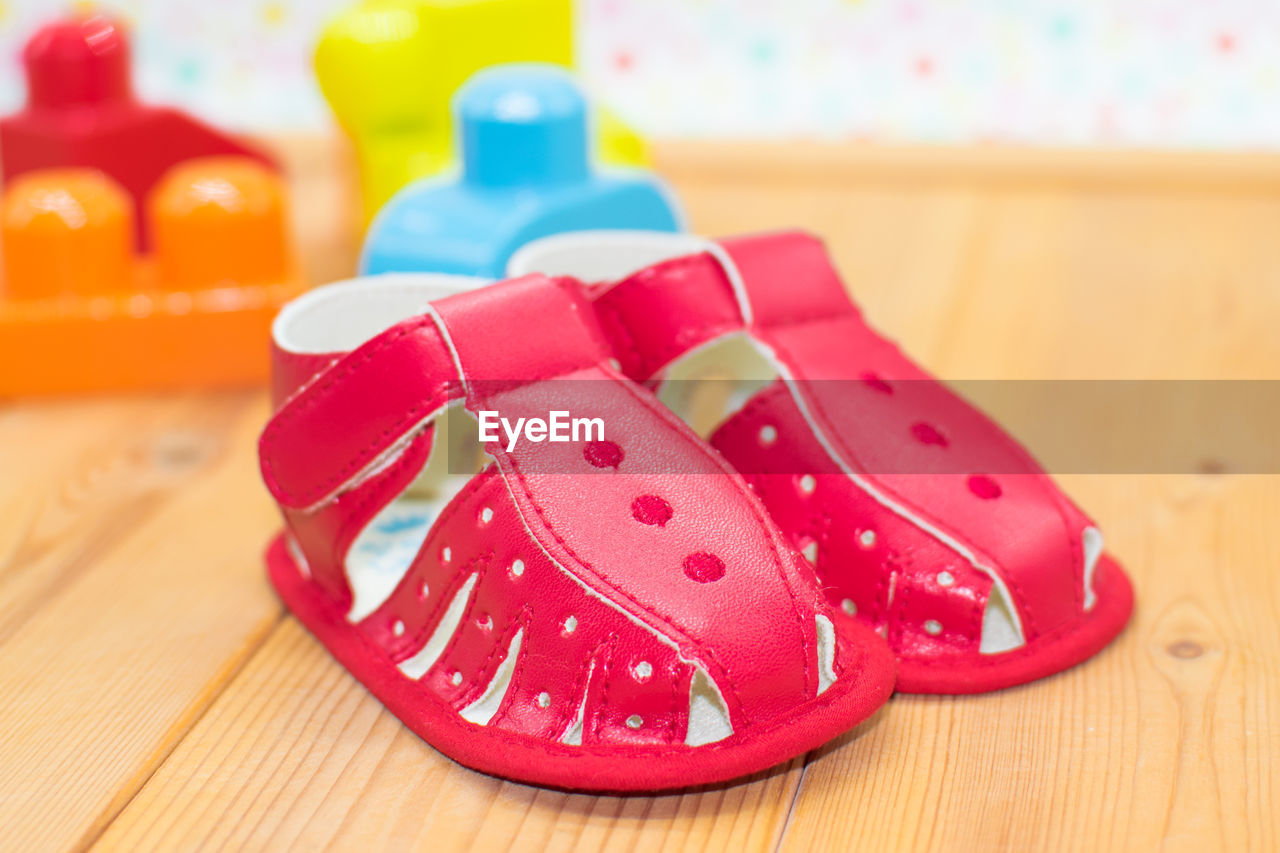 Close-up of baby booties on table