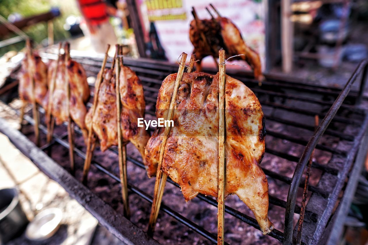 CLOSE-UP OF MEAT FOR SALE IN BARBECUE GRILL