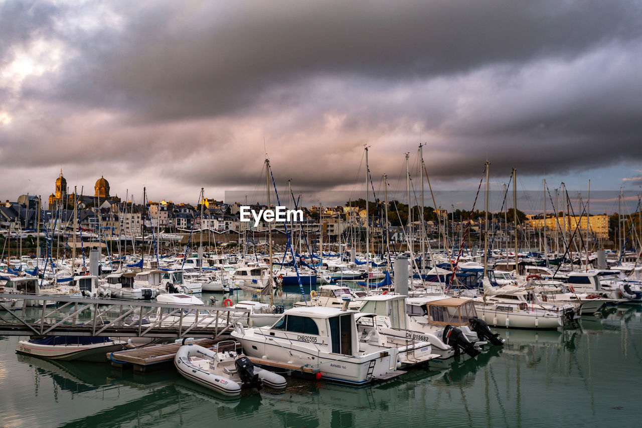 Boats moored at harbor