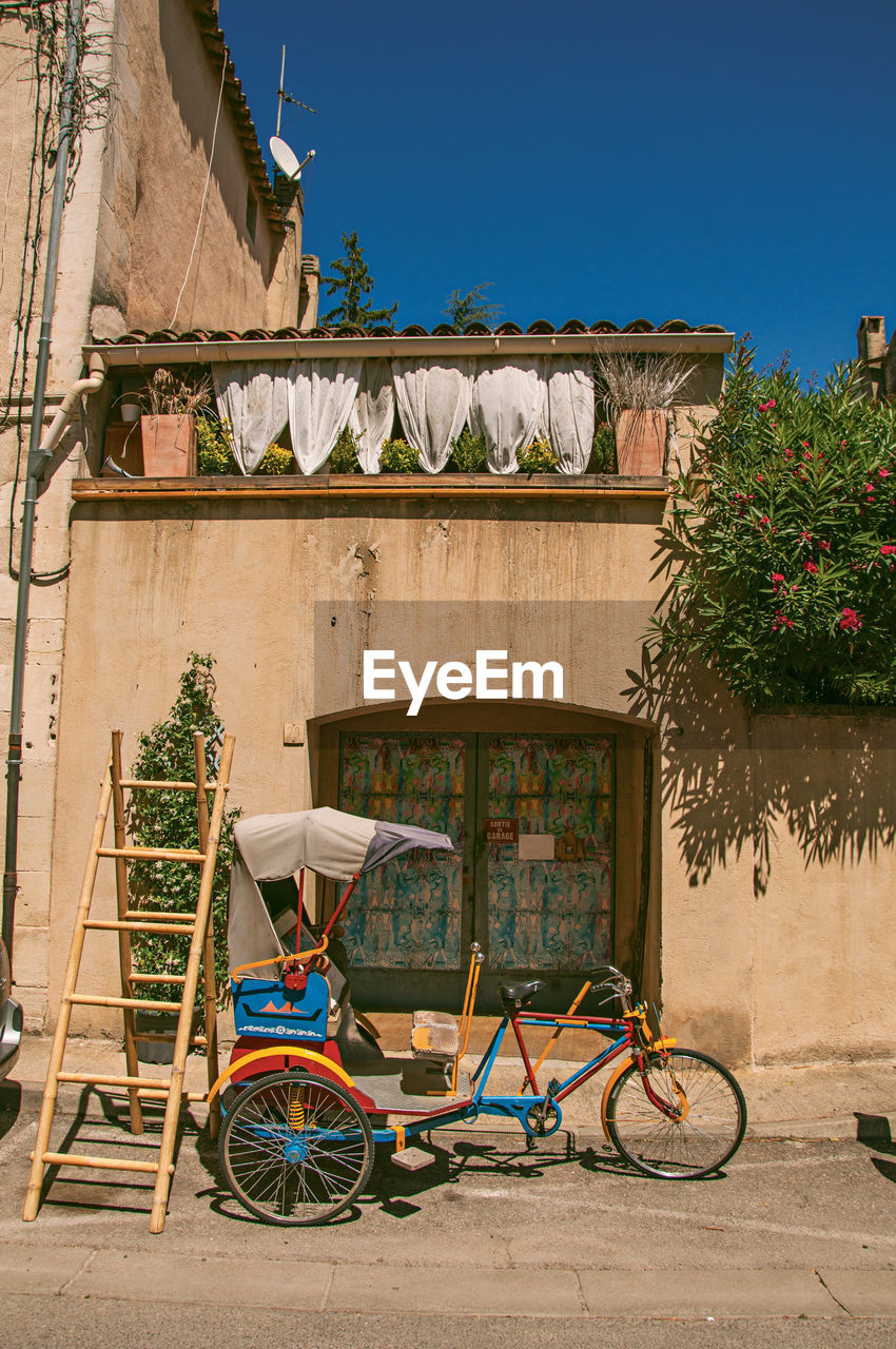 BICYCLES ON STREET AGAINST BUILDINGS