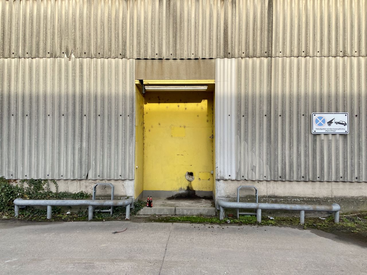 YELLOW BUILDING WITH CLOSED GATE