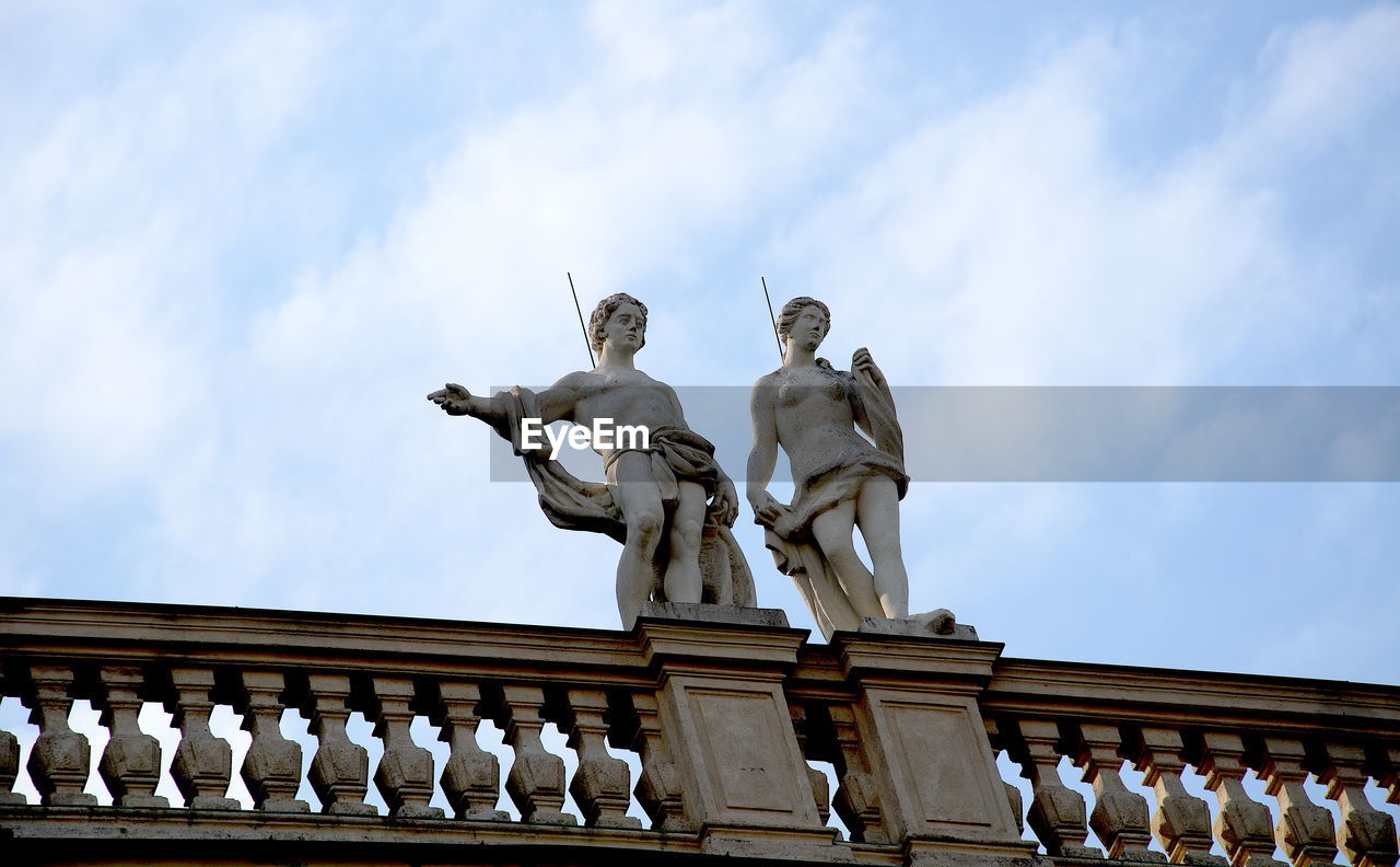 Low angle view of statue against sky