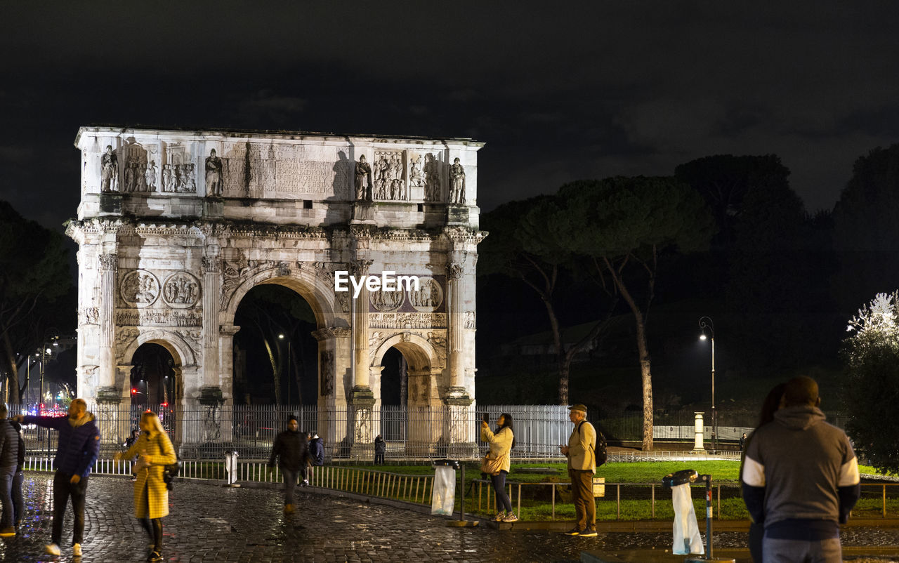 Famous trajan's arch of rome photographed at night, travel reportage.