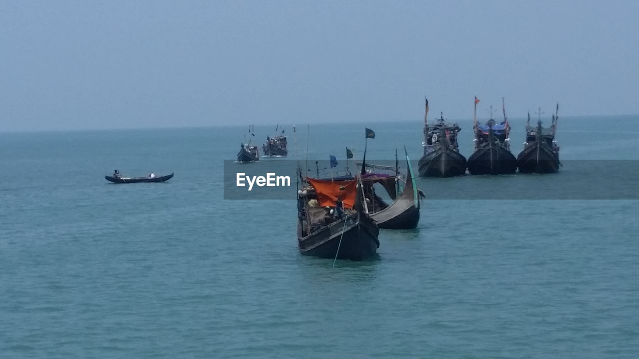 VIEW OF BOATS IN SEA