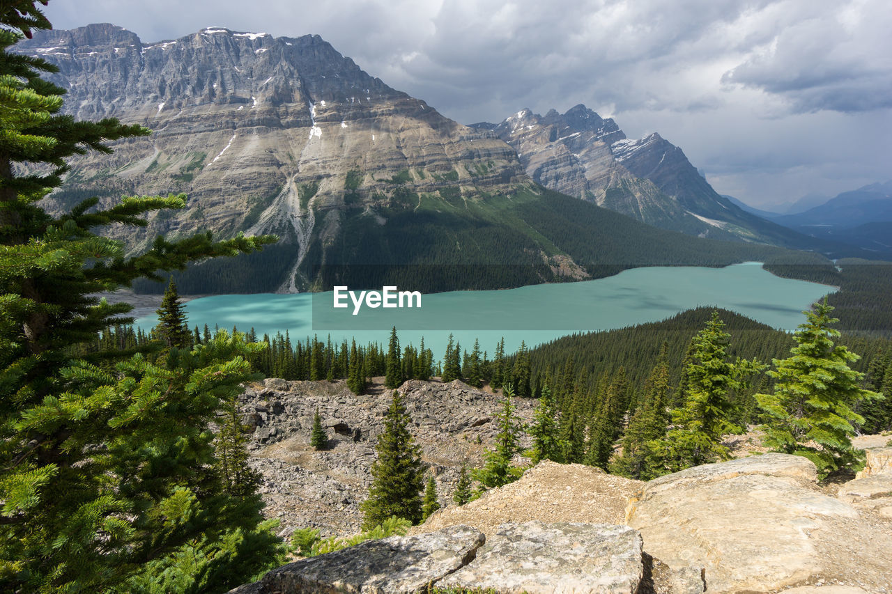 Scenic view of lake and mountains against sky