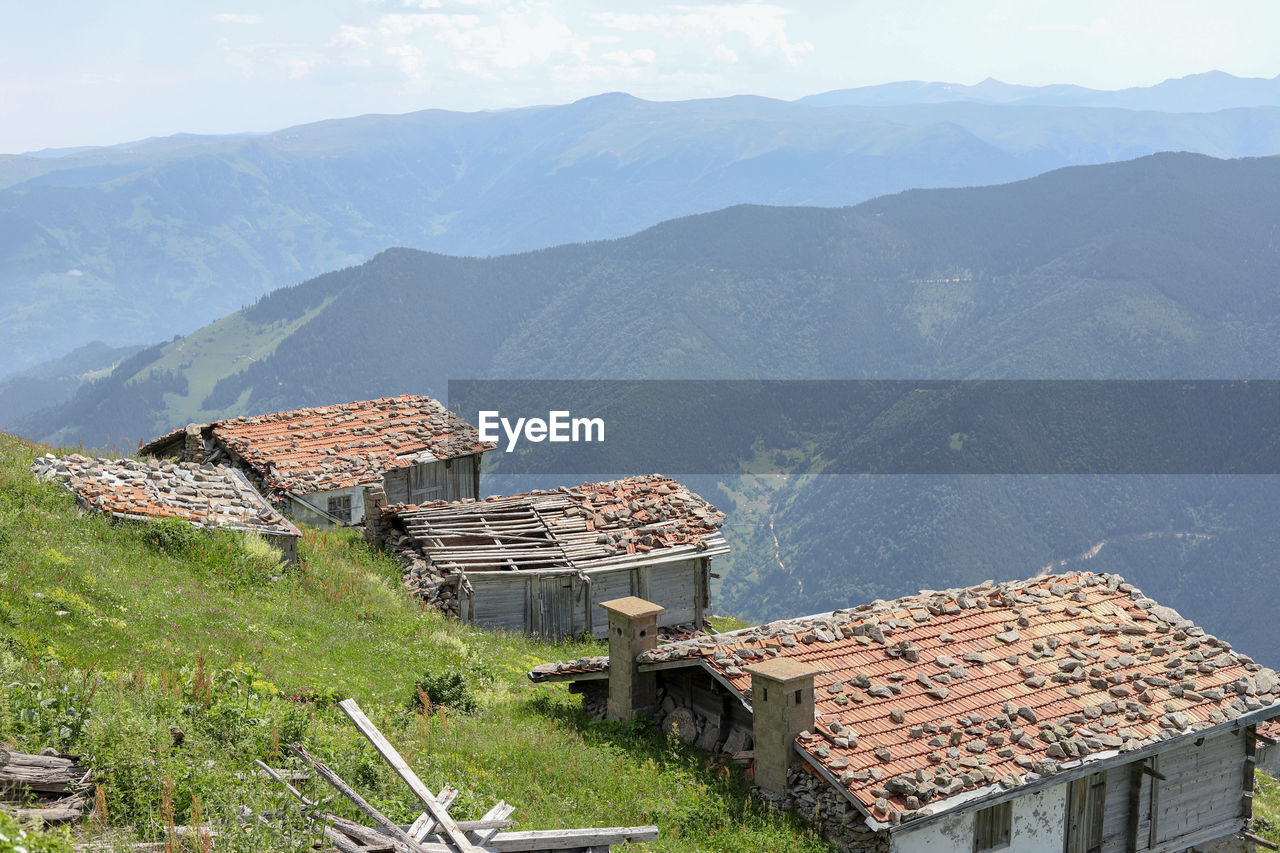 High angle view of houses on mountain against sky
