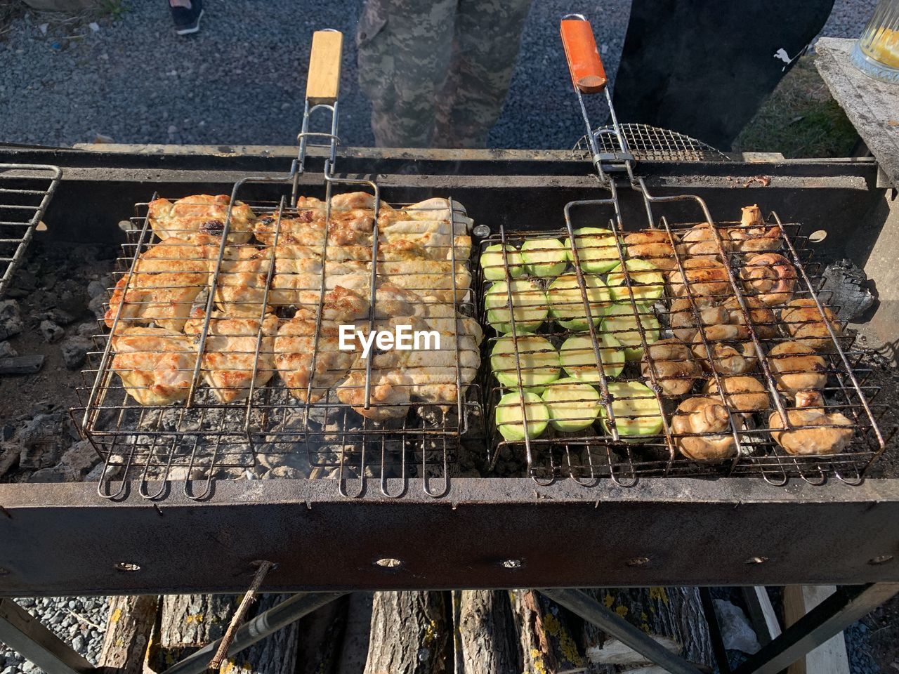 High angle view of meat on barbecue grill