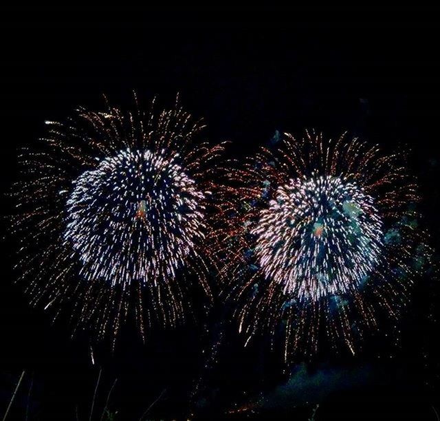 LOW ANGLE VIEW OF FIREWORKS DISPLAY