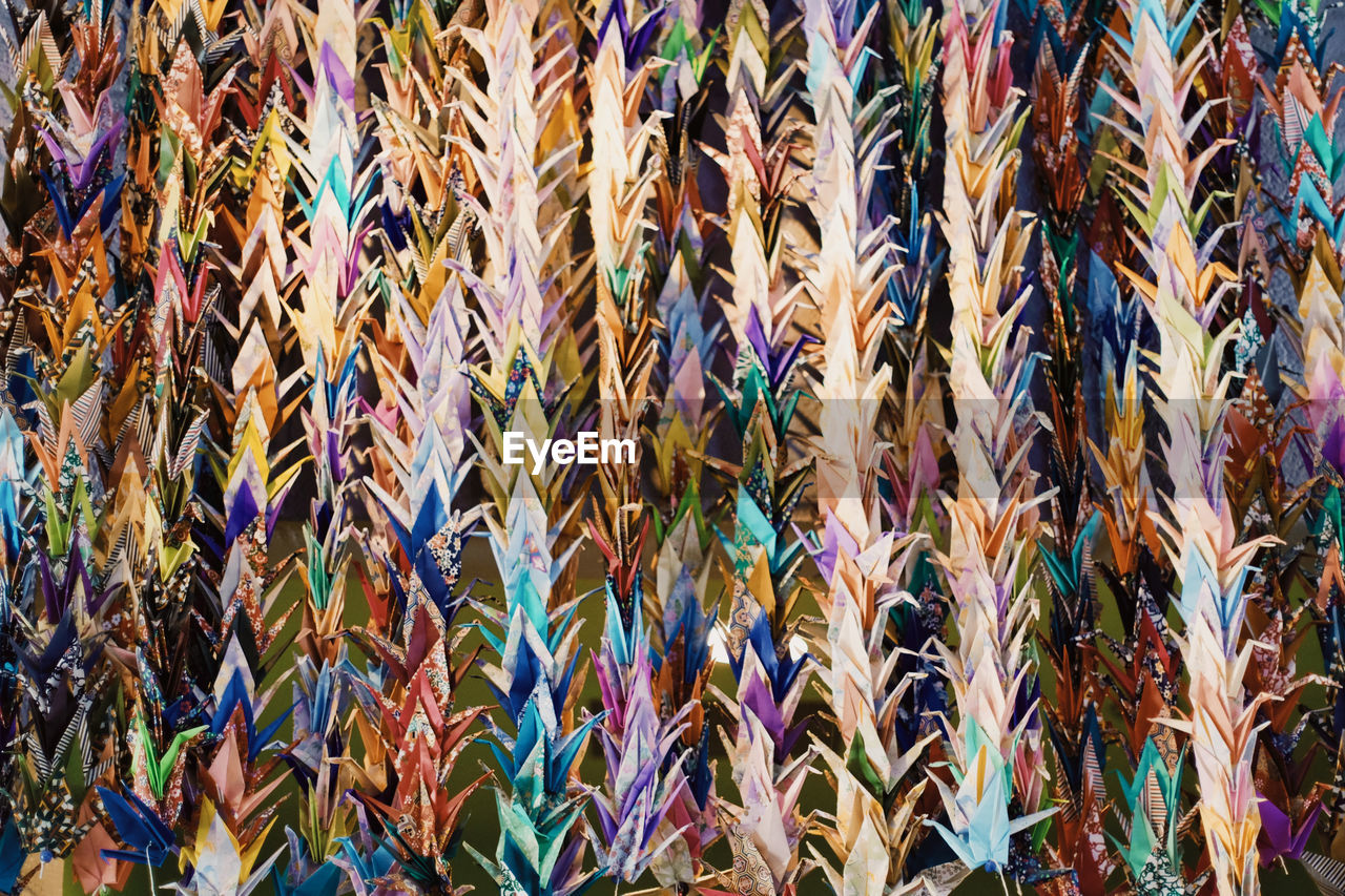 Full frame shot of colorful paper cranes