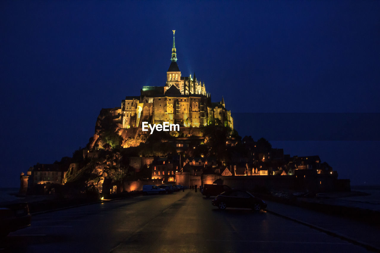 ILLUMINATED CITYSCAPE AT NIGHT