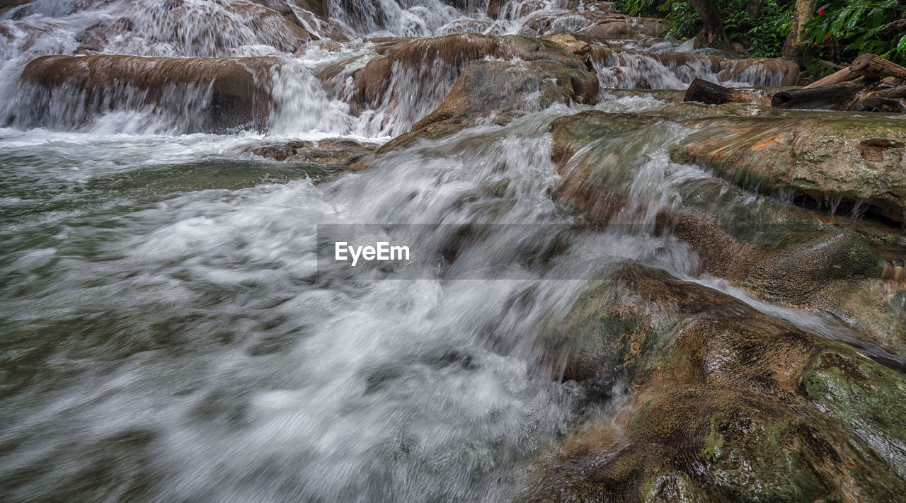 RIVER FLOWING THROUGH ROCKS