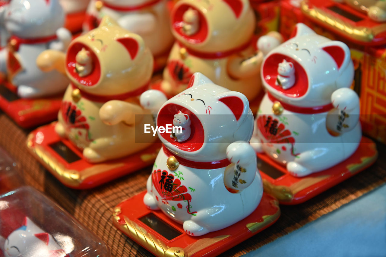 red, no people, chinese new year, animal representation, food, representation, ceramic, holiday, large group of objects, toy, market, retail, porcelain, close-up, craft, celebration, figurine, festival, tradition, sweetness, luck, for sale, store