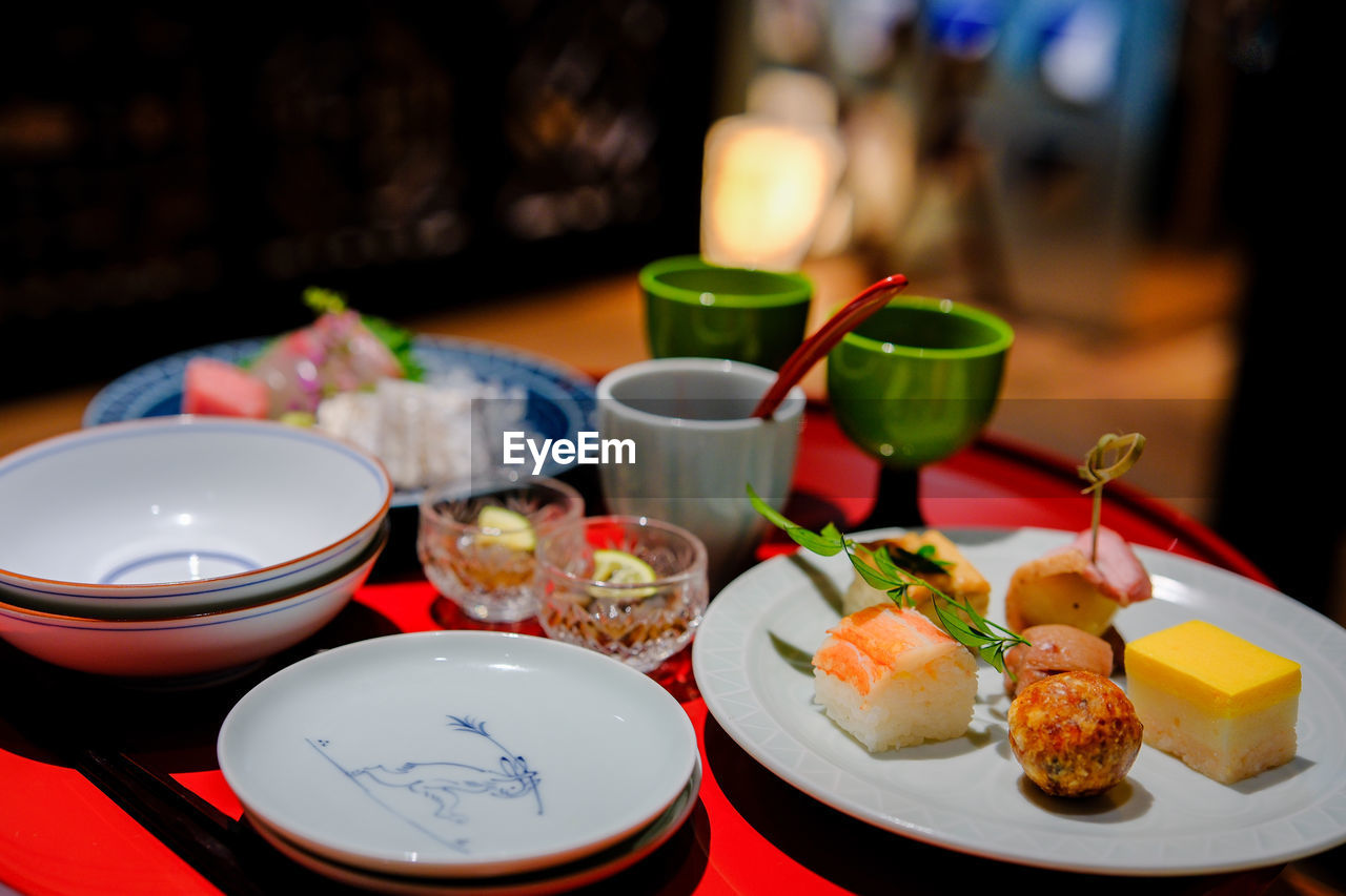 food and drink, food, plate, tableware, meal, dish, healthy eating, table, asian food, bowl, wellbeing, platter, cuisine, no people, freshness, seafood, lunch, japanese food, restaurant, culture, focus on foreground, brunch, indoors, chopsticks, dinner, crockery, sushi