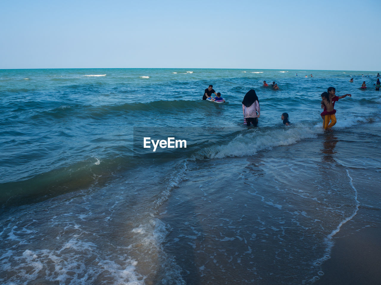 GROUP OF PEOPLE ON BEACH