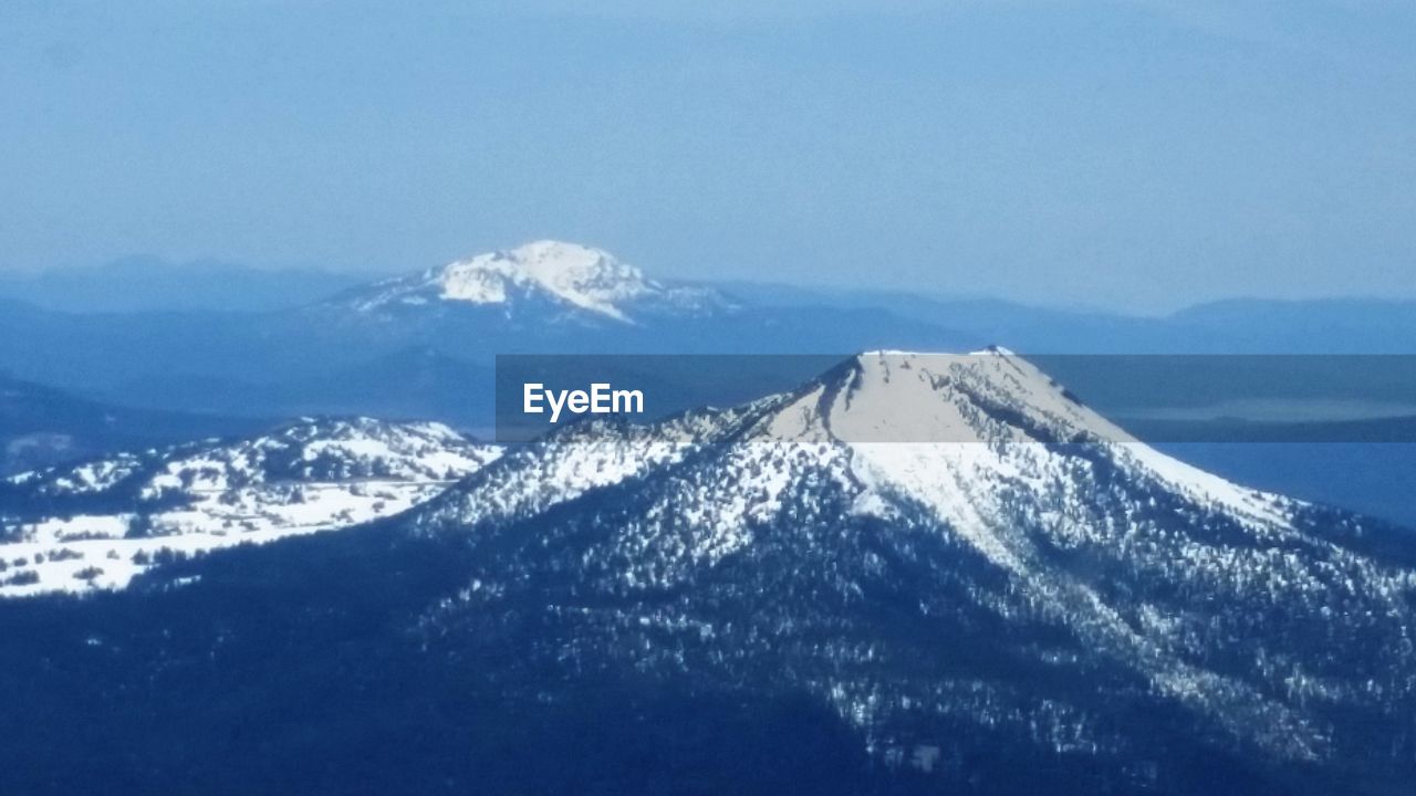 SNOW COVERED MOUNTAIN AGAINST CLEAR SKY