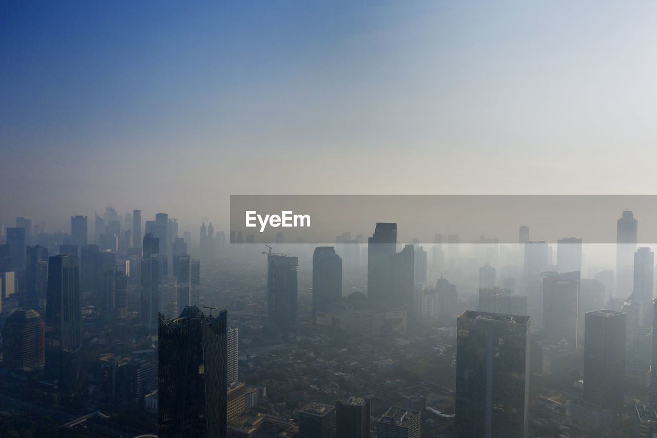 BUILDINGS IN CITY AGAINST SKY