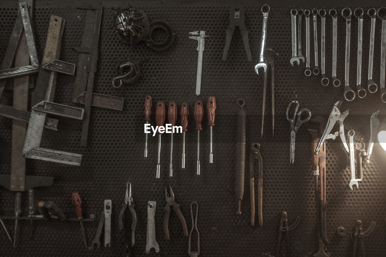 Full frame shot of equipment hanging on metal