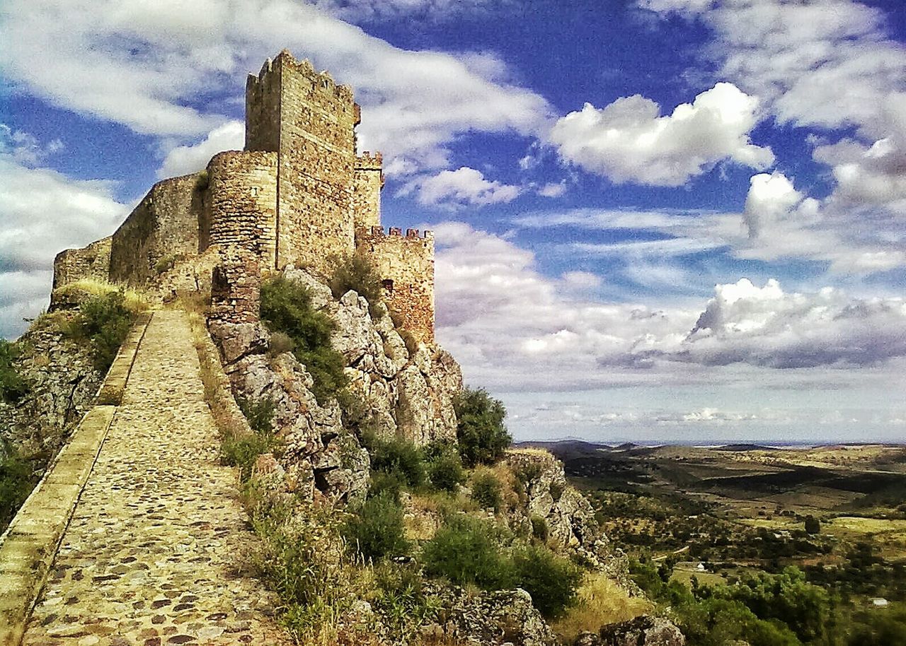 VIEW OF CASTLE AGAINST CLOUDY SKY