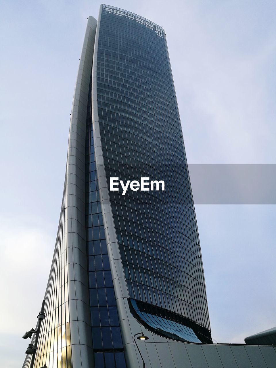 LOW ANGLE VIEW OF MODERN SKYSCRAPER