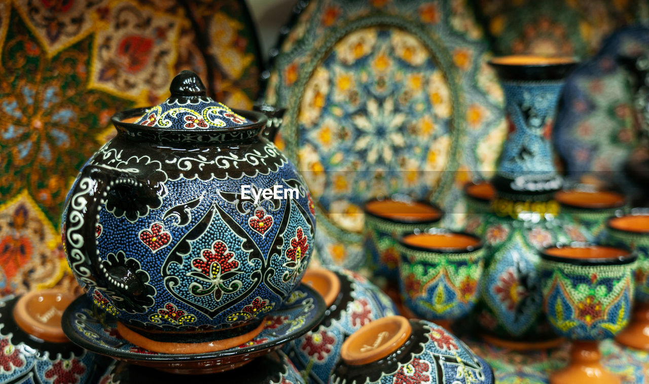 Close-up of pottery for sale at market stall