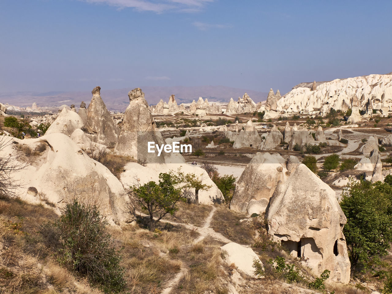 PANORAMIC VIEW OF ROCKS AND LANDSCAPE AGAINST SKY