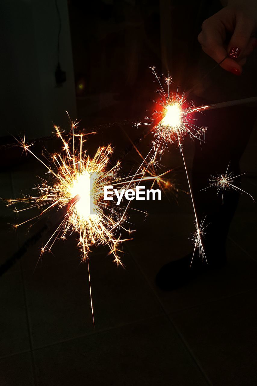 LOW ANGLE VIEW OF FIREWORKS DISPLAY