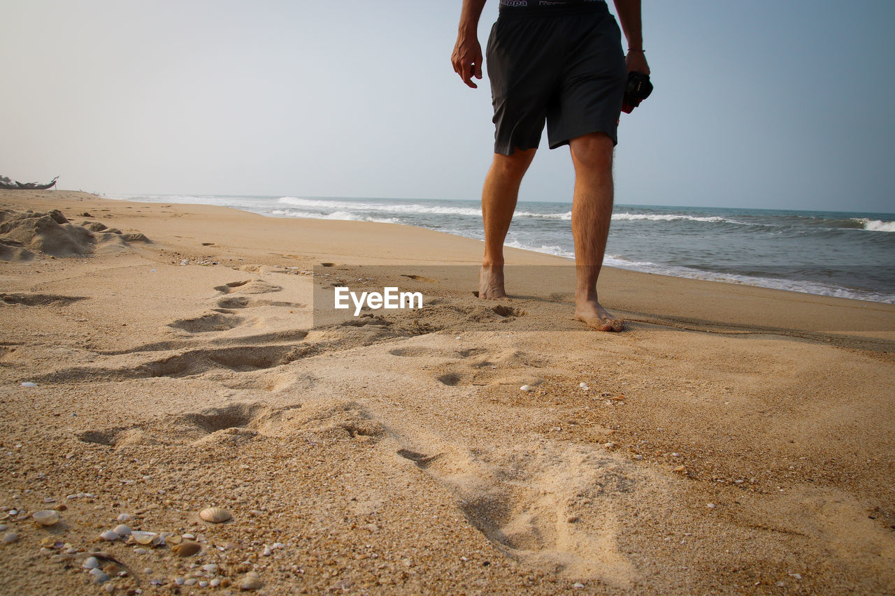 Low section of man on beach