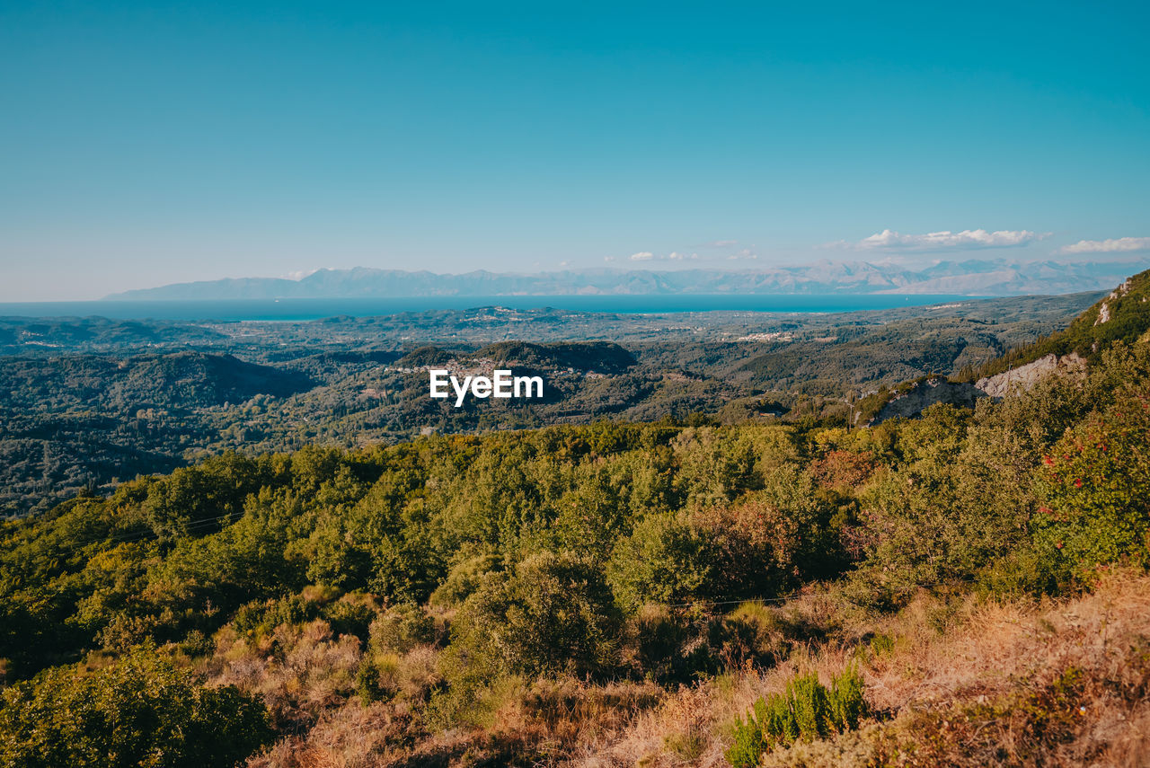 SCENIC VIEW OF LAND AGAINST CLEAR BLUE SKY