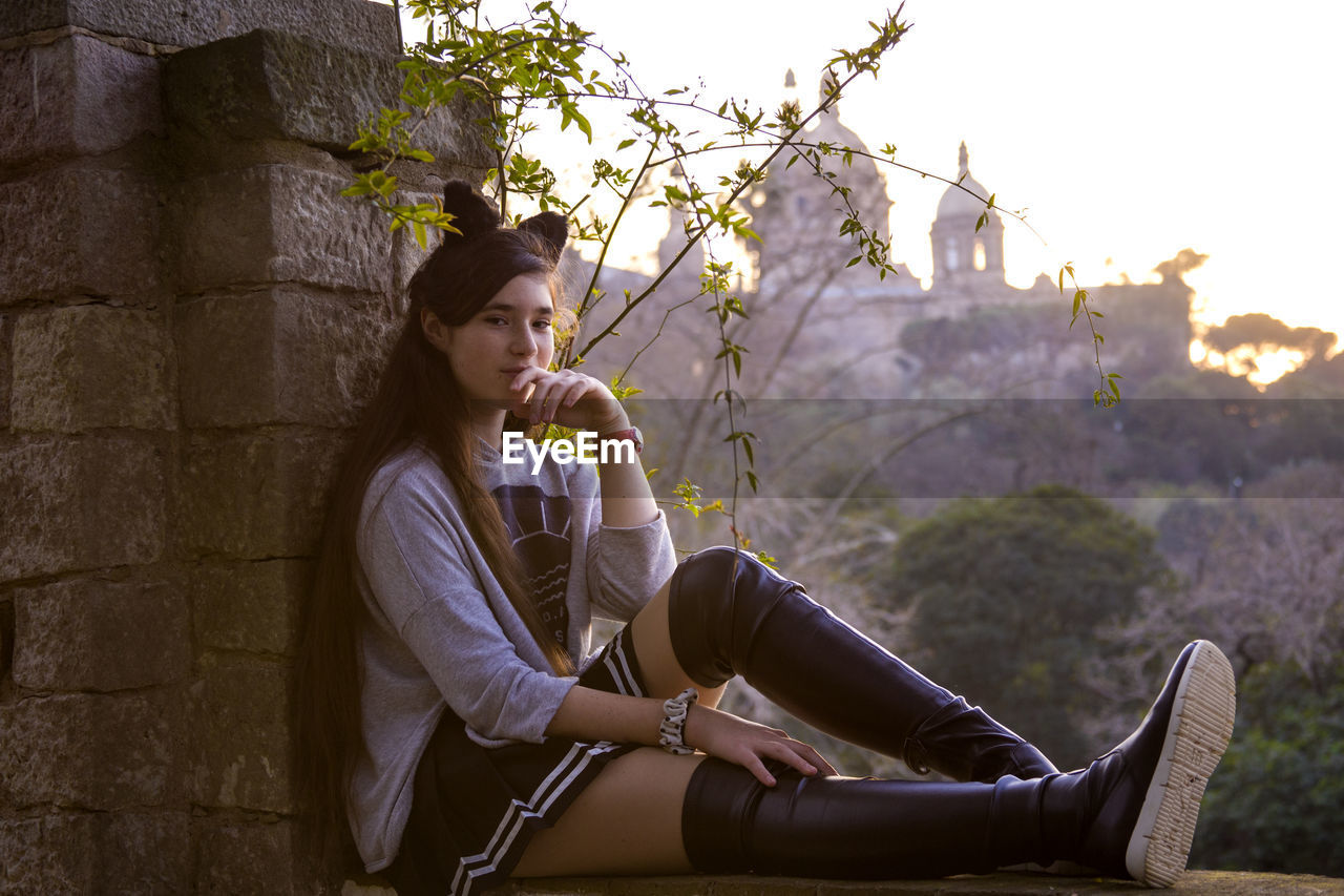 Portrait of woman sitting outdoors