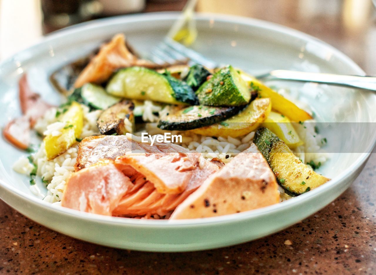 Close-up of gluten free salmon meal served in plate