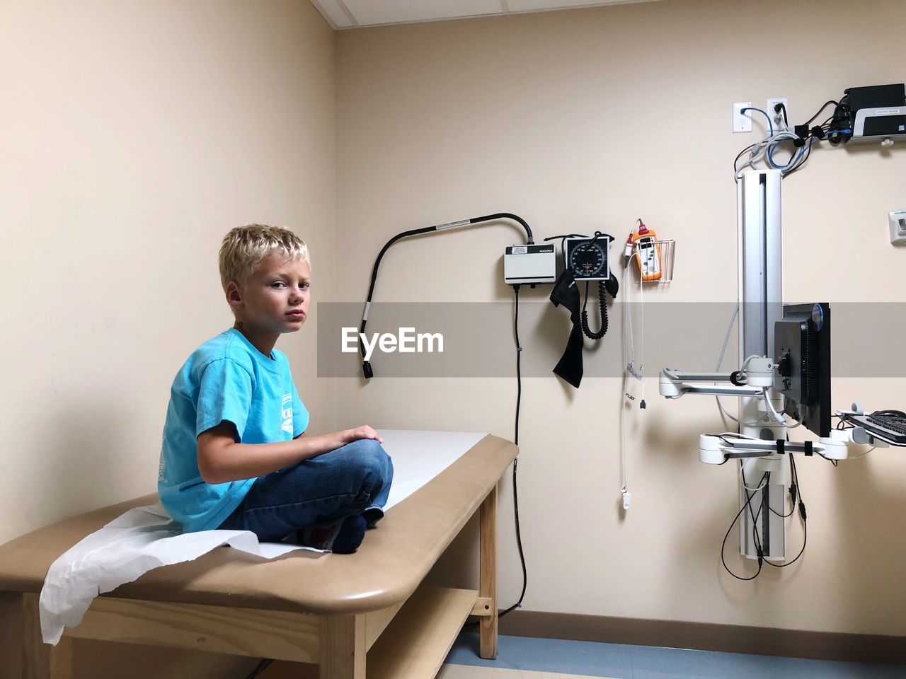 Portrait of boy sitting in hospital