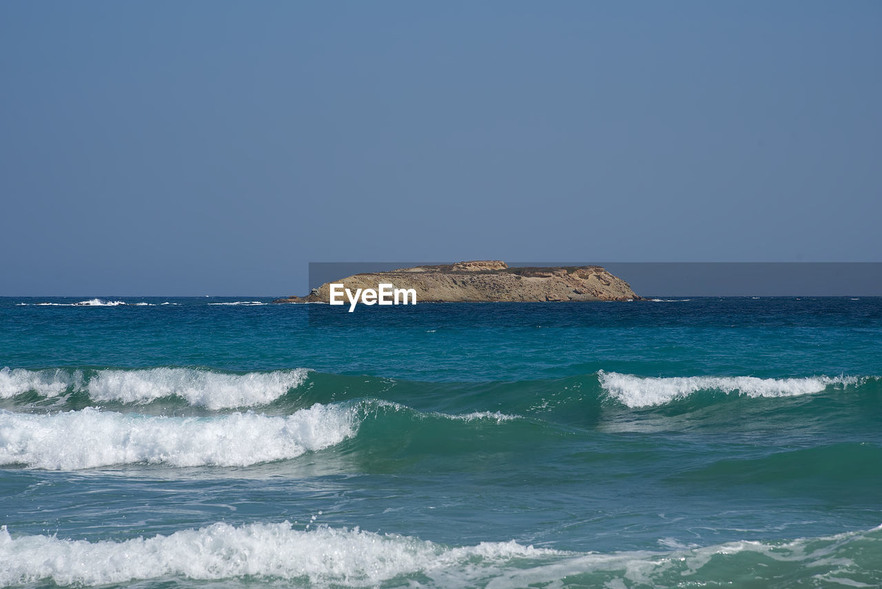 Scenic view of sea against clear sky