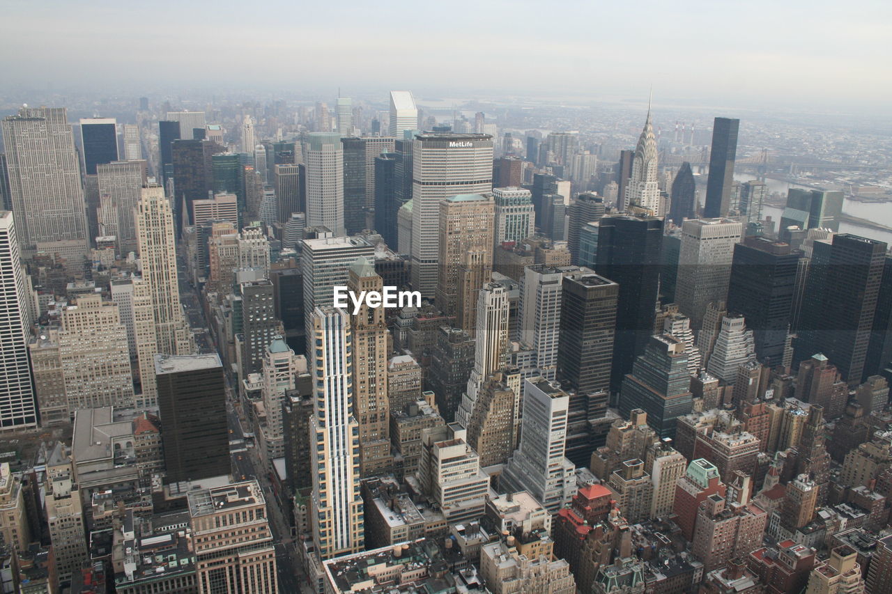 HIGH ANGLE VIEW OF MODERN BUILDINGS IN CITY