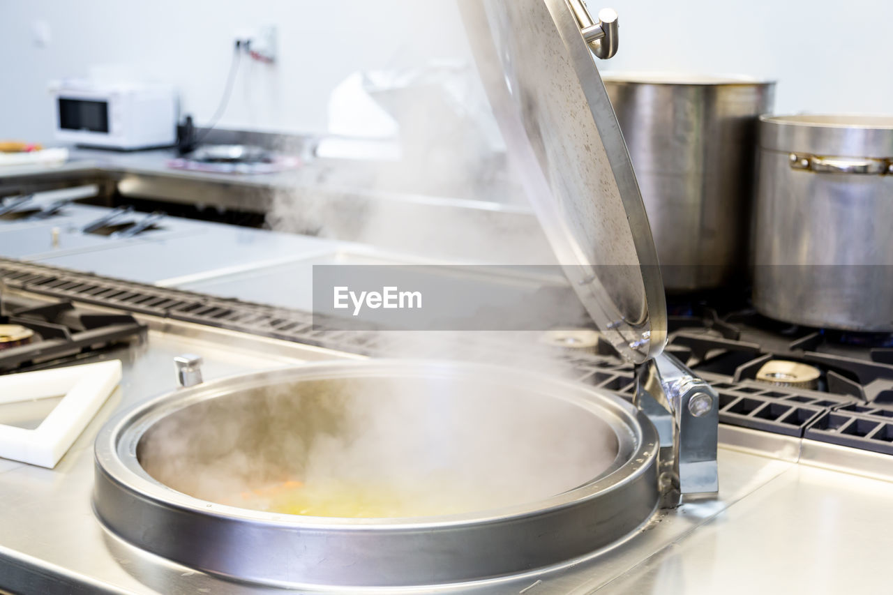 Steam emitting from container in kitchen