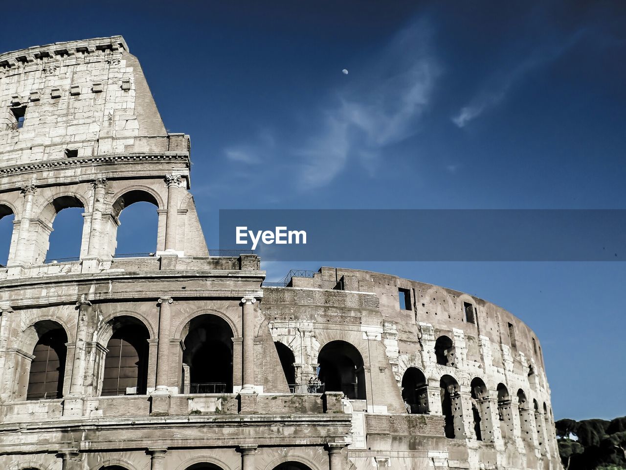 Low angle view of coliseum against sky