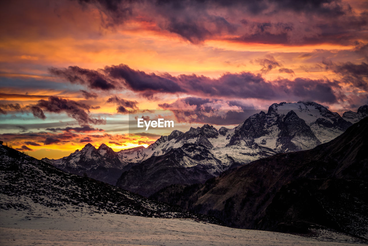 Scenic view of mountains against dramatic sky