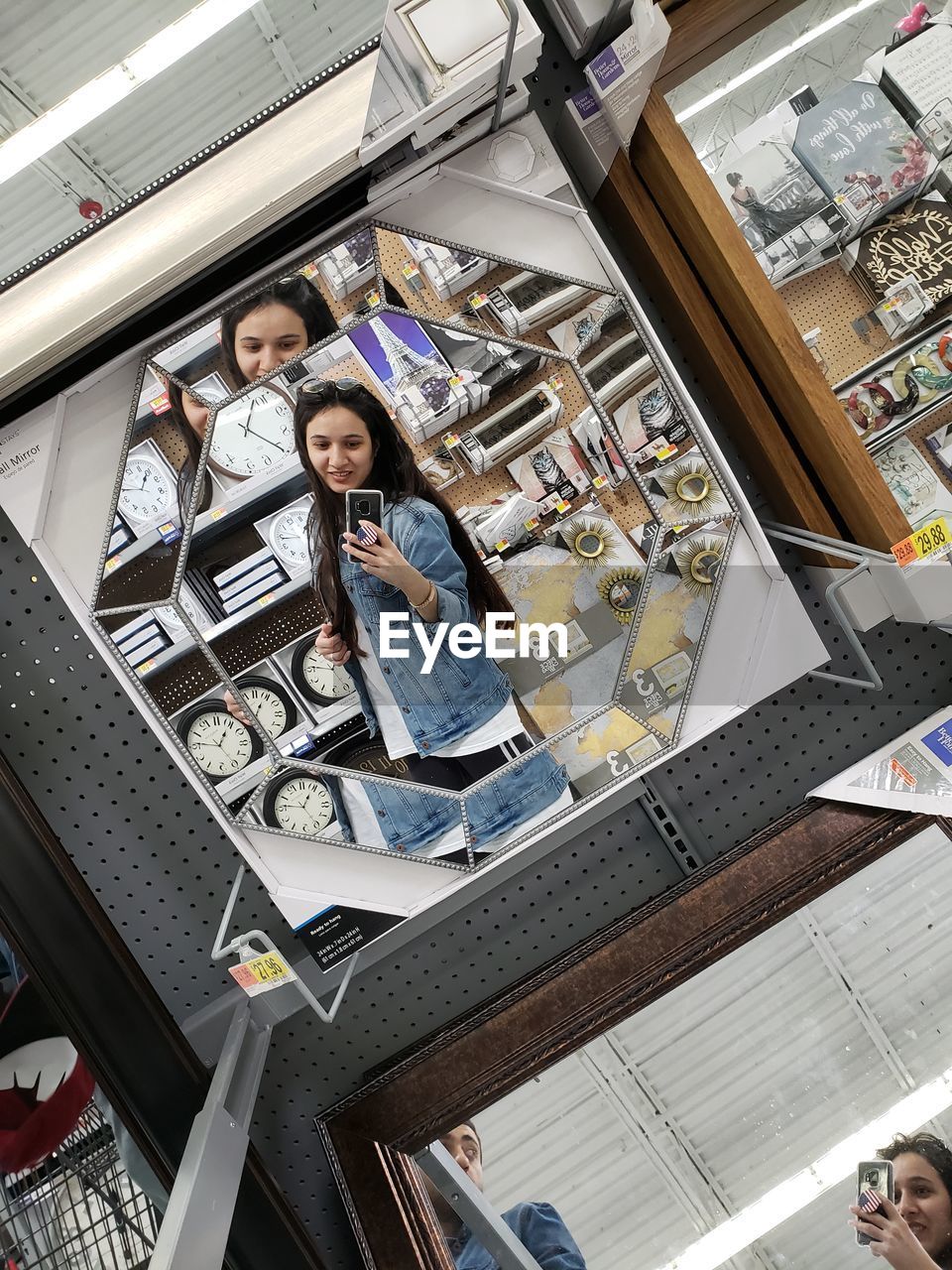 HIGH ANGLE VIEW OF PEOPLE STANDING IN STORE