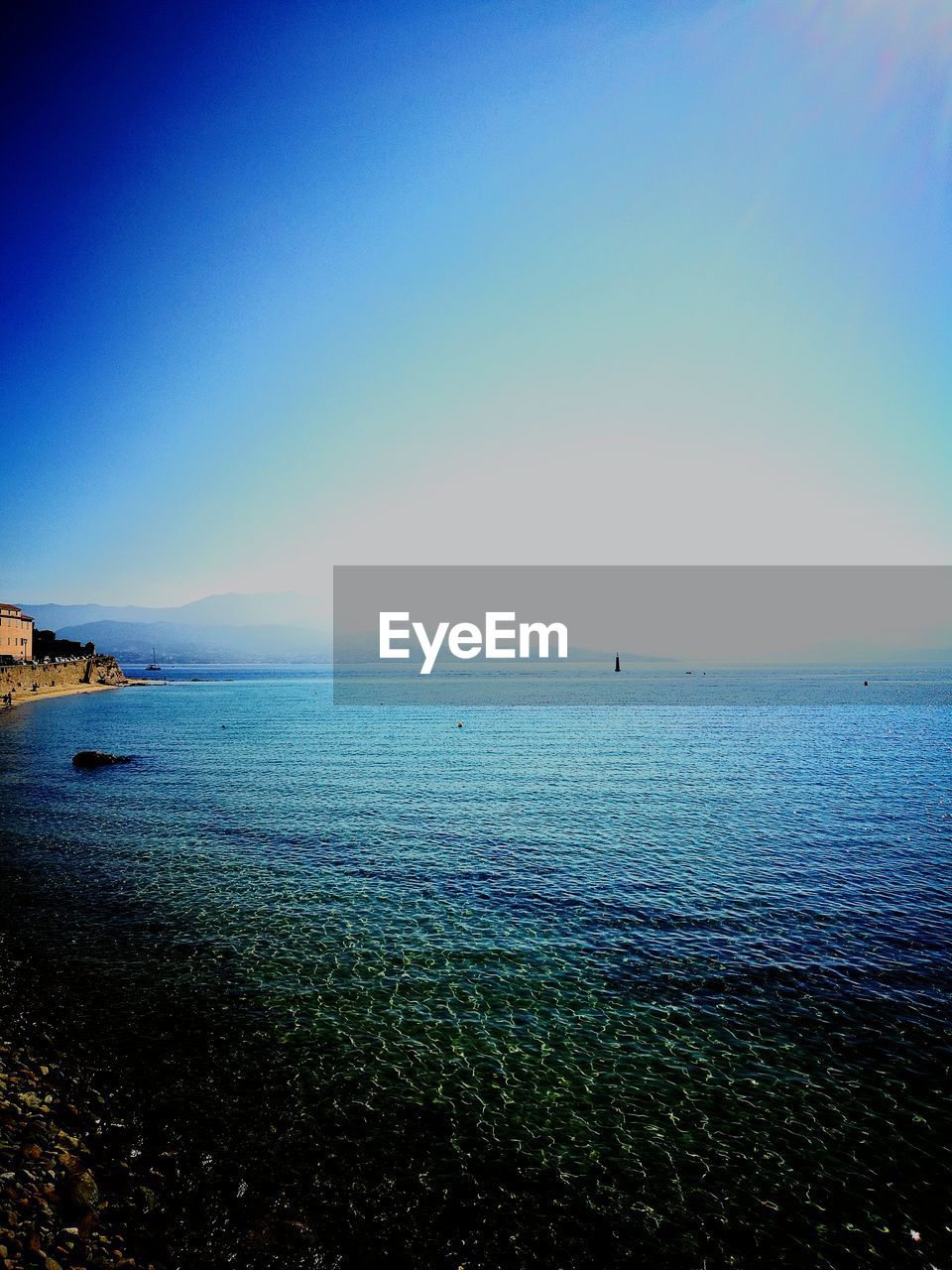 SCENIC VIEW OF SEA AGAINST BLUE SKY