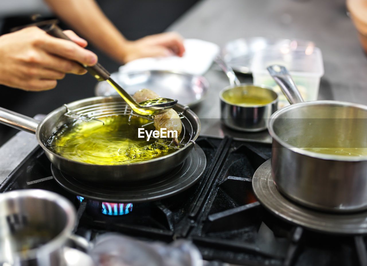 midsection of chef preparing food