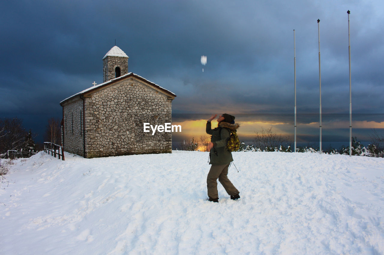 FULL LENGTH OF MAN ON SNOW FIELD