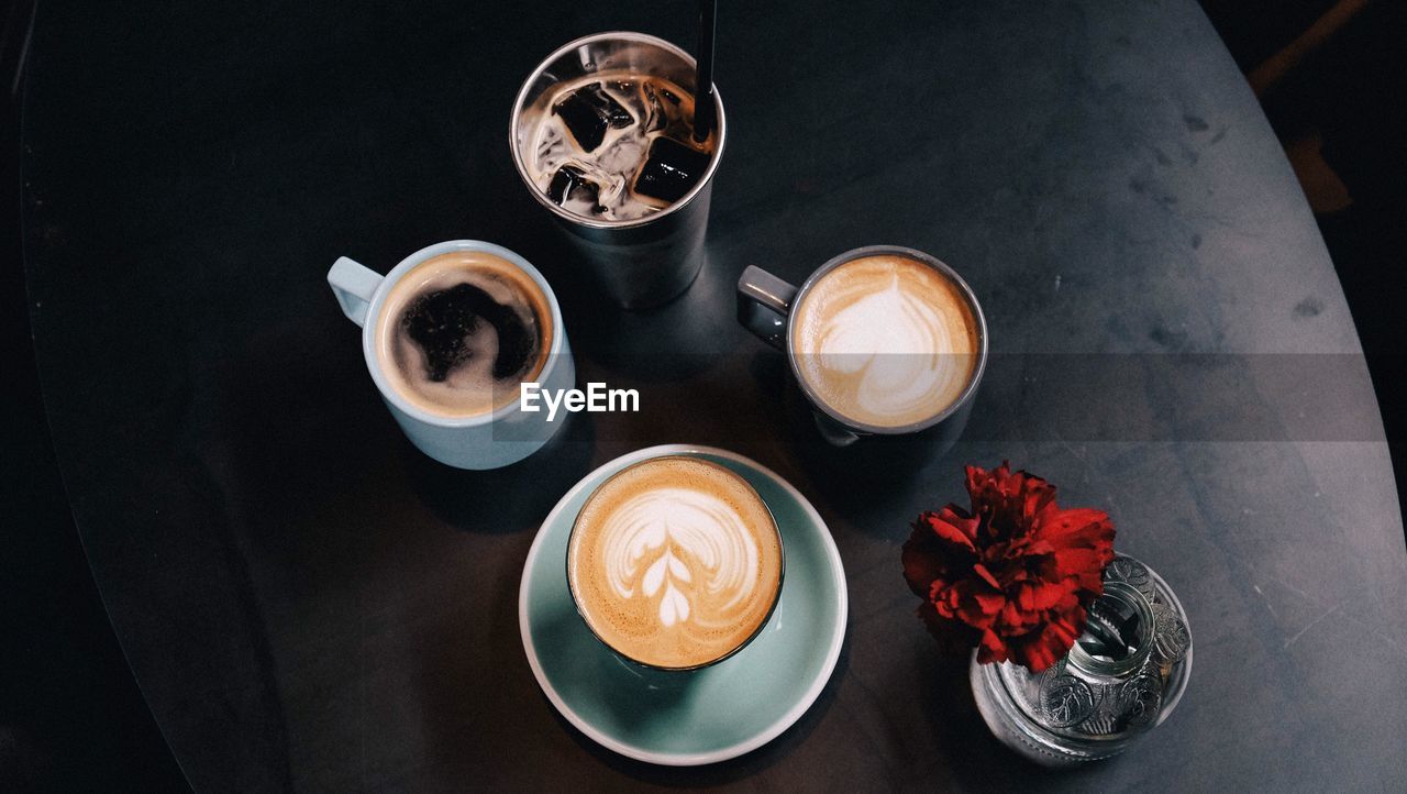 High angle view of coffee cups on table