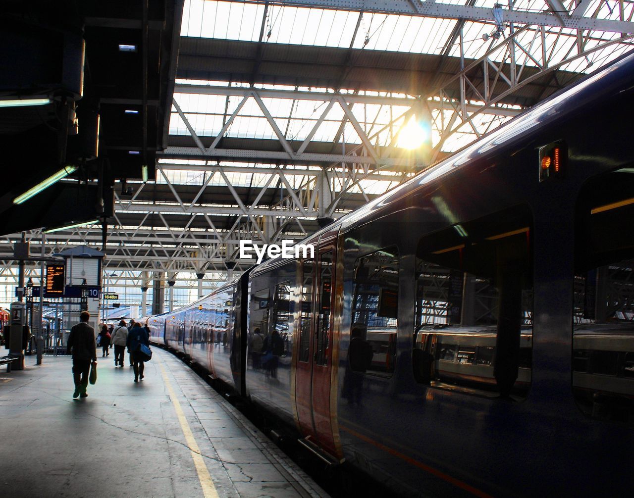 TRAIN ON RAILROAD STATION PLATFORM