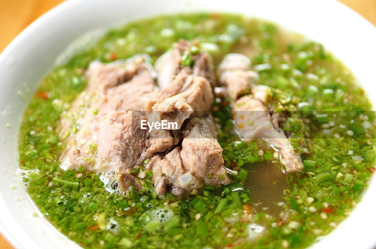 CLOSE-UP OF SOUP IN BOWL ON TABLE