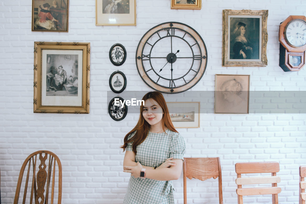 Smiling young woman at home