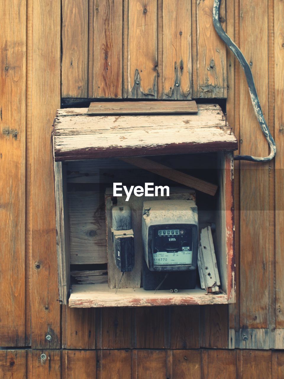 Meter box on wooden wall