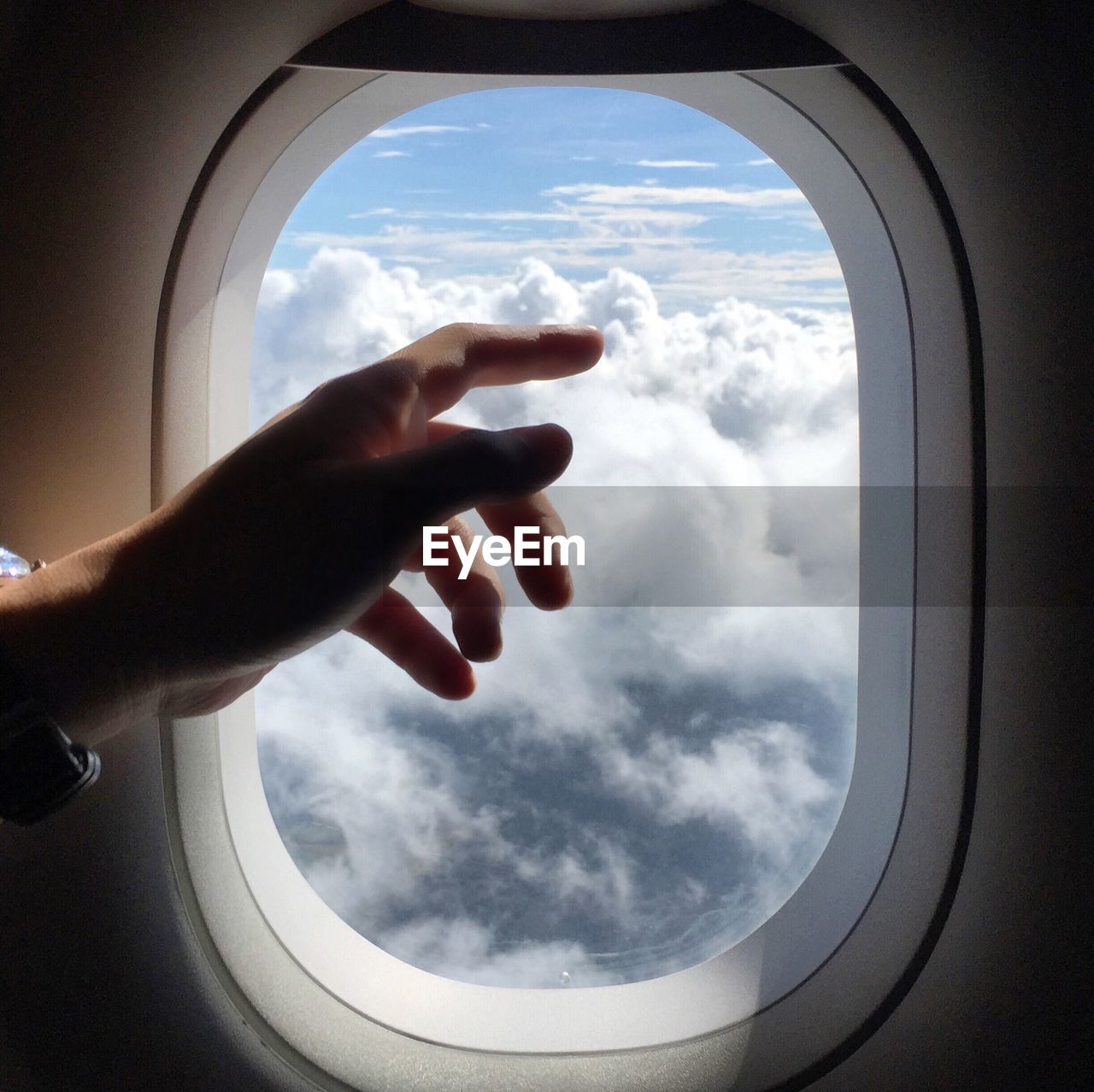 LOW ANGLE VIEW OF CROPPED CAR WINDOW