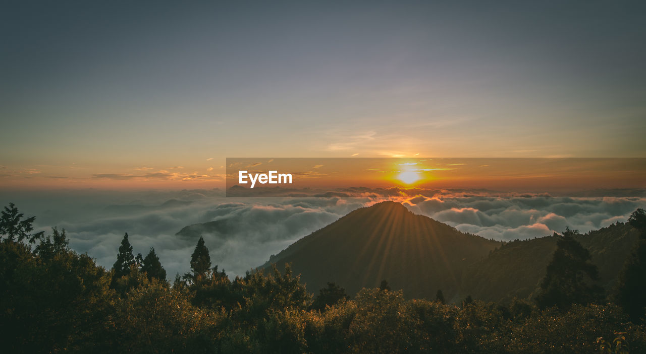 Scenic view of mountains against sky during sunset