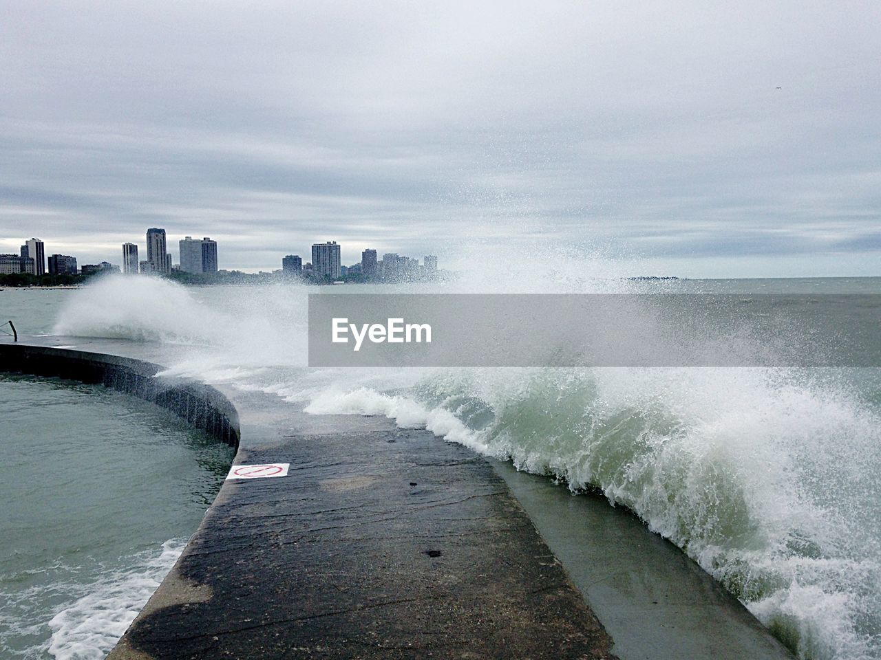 View of waves breaking on jetty