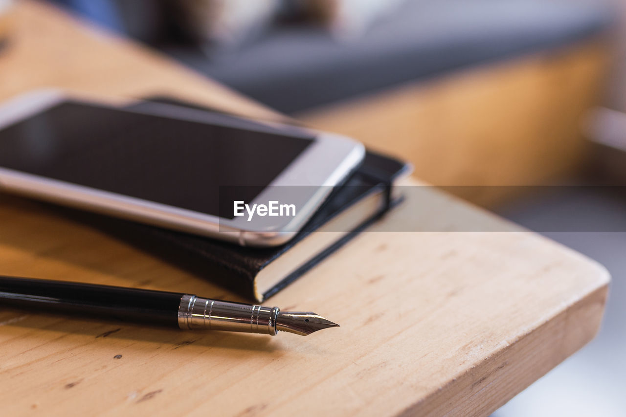 CLOSE-UP OF LAPTOP ON TABLE